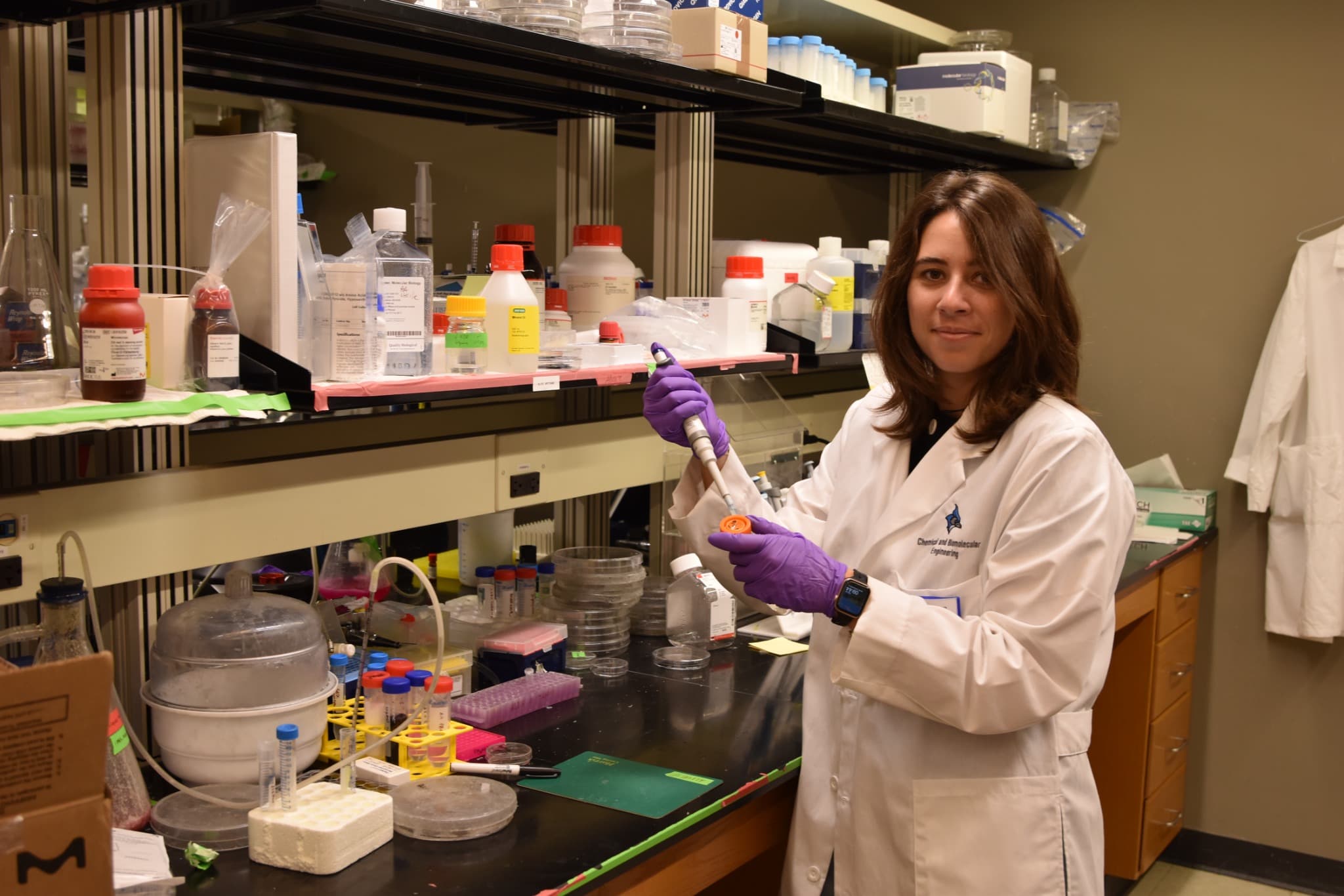 Alice Amitrano working at a laboratory bench