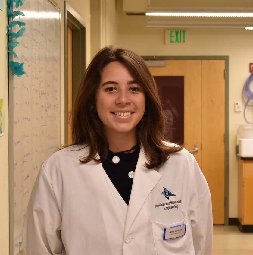 Alice Amitrano in a laboratory, wearing a white lab coat